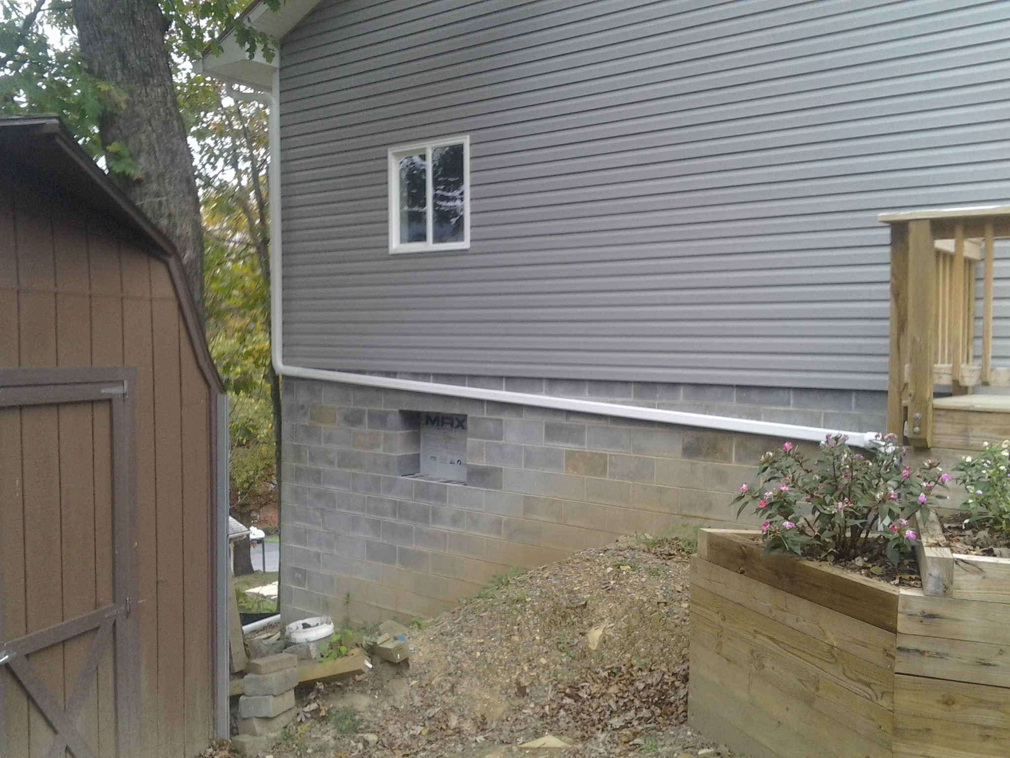 Attached picture Back down spout.jpg